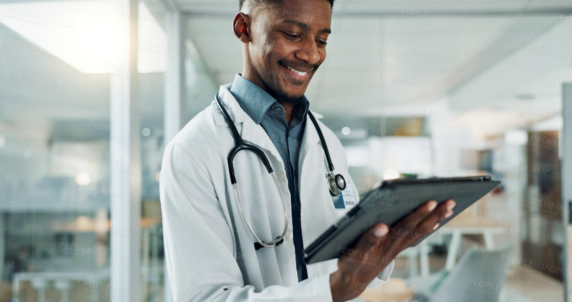 Buy stock photo Tablet, research and happy black man doctor on internet for medical or healthcare information online in a hospital. Smile, medicine and professional typing on health website or app in a modern clinic