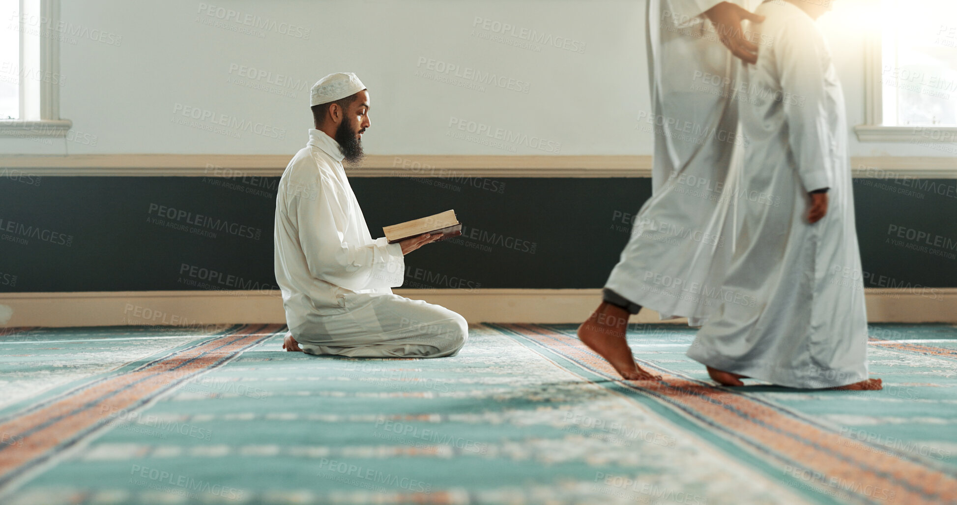 Buy stock photo Quran, islamic and man with faith in a mosque for praying, peace and spiritual care in holy religion for Allah. Reading, Ramadan and Muslim person with kindness, hope and humble after worship