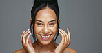 Face, skincare and hands of happy woman in studio isolated on a gray background. Portrait, natural beauty and model touch in spa facial treatment for aesthetic, glow and cosmetic wellness for health