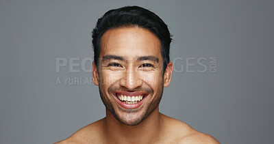 Man, face and natural beauty with hygiene and cosmetics, headshot and skincare isolated on grey background. Mockup space, portrait and clean dermatology, smile with grooming and self care in studio