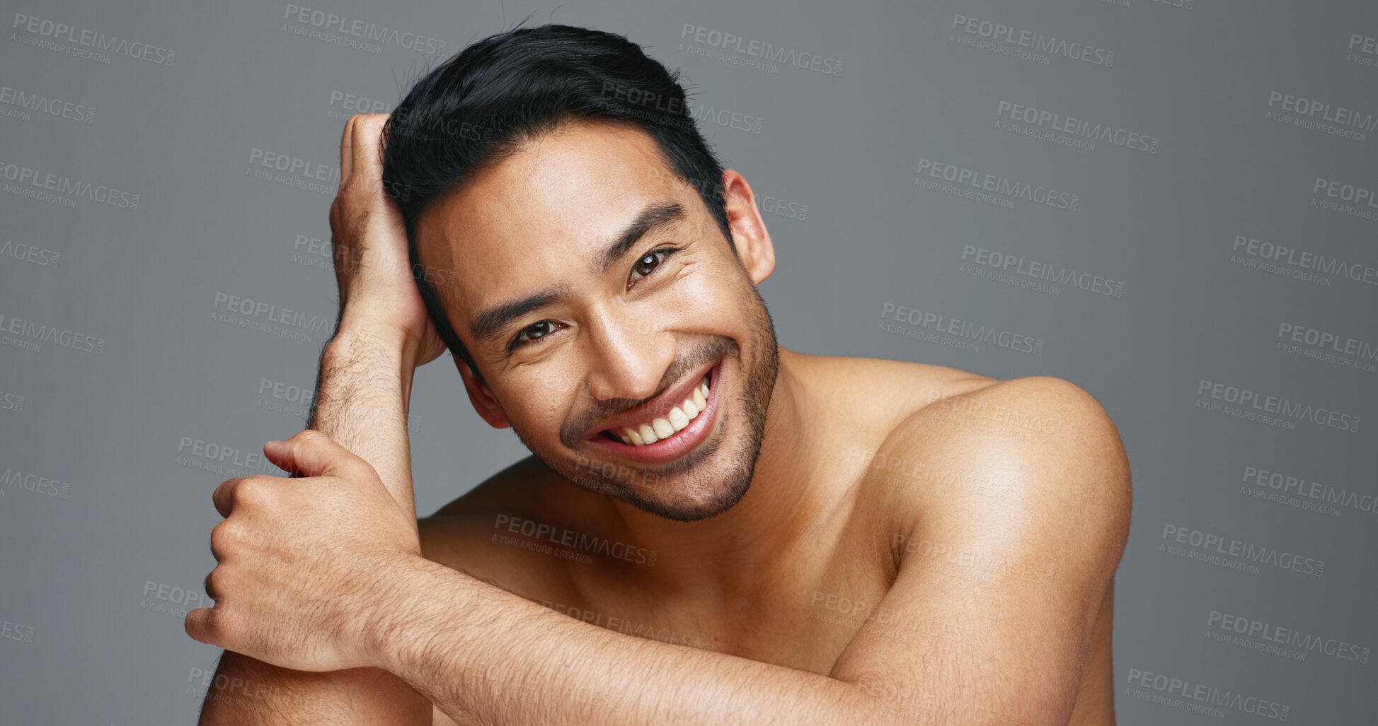 Buy stock photo Face, cosmetics and Asian man with skincare, smile and dermatology on a grey studio background. Portrait, Japanese person and happy model with wellness, luxury treatment and beauty with aesthetic