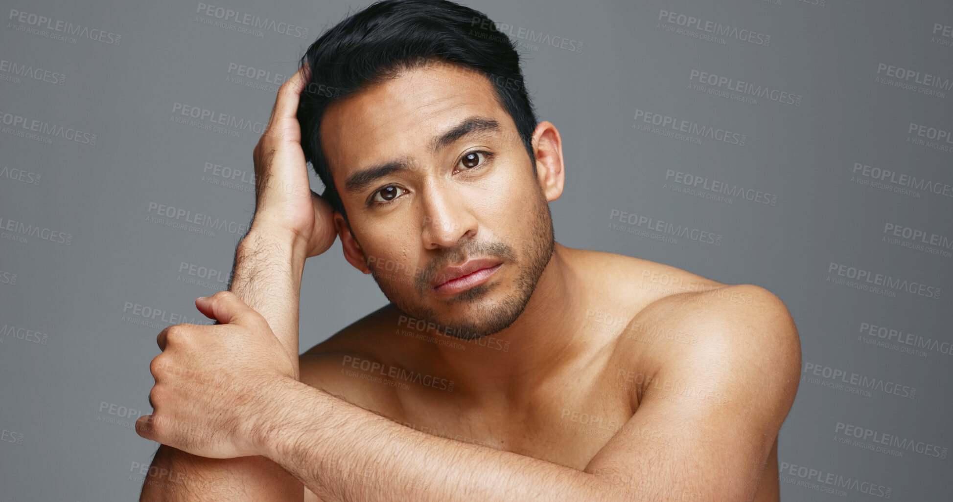 Buy stock photo Face, cosmetics and Asian man with beauty, wellness and dermatology on a grey studio background. Portrait, Japanese person or model with healthy skin, luxury treatment and spa grooming with aesthetic