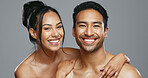 Couple, smile and care for skincare, happy and portrait for wellness in studio by gray background. Happy people, dermatology and hug for cosmetics, hydration and glow or love for skin treatment