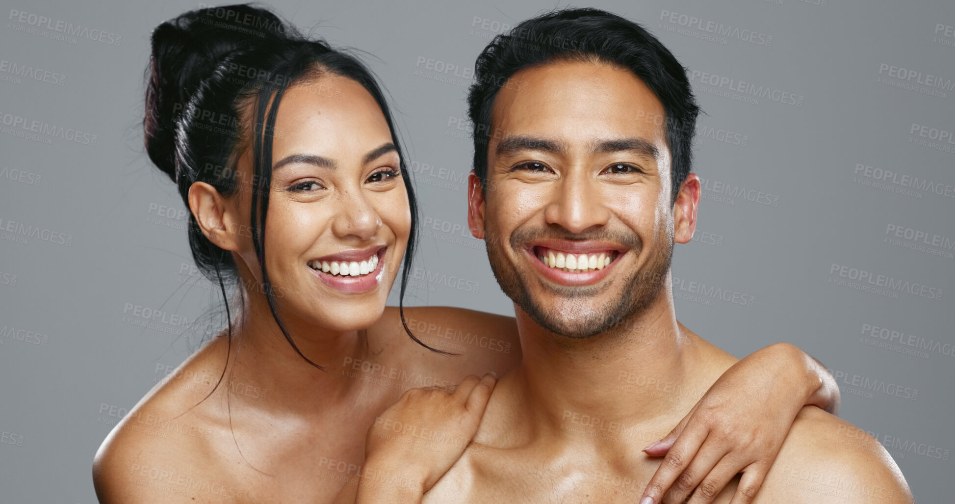 Buy stock photo Couple, smile and care for skincare, happy and portrait for wellness in studio by gray background. Happy people, dermatology and hug for cosmetics, hydration and glow or love for skin treatment