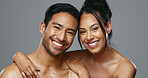 Couple, smile and care for skincare, love and portrait with moisturizer in studio by gray background. Happy people, dermatology and hug for cosmetics, hydration and creme or happy for skin treatment