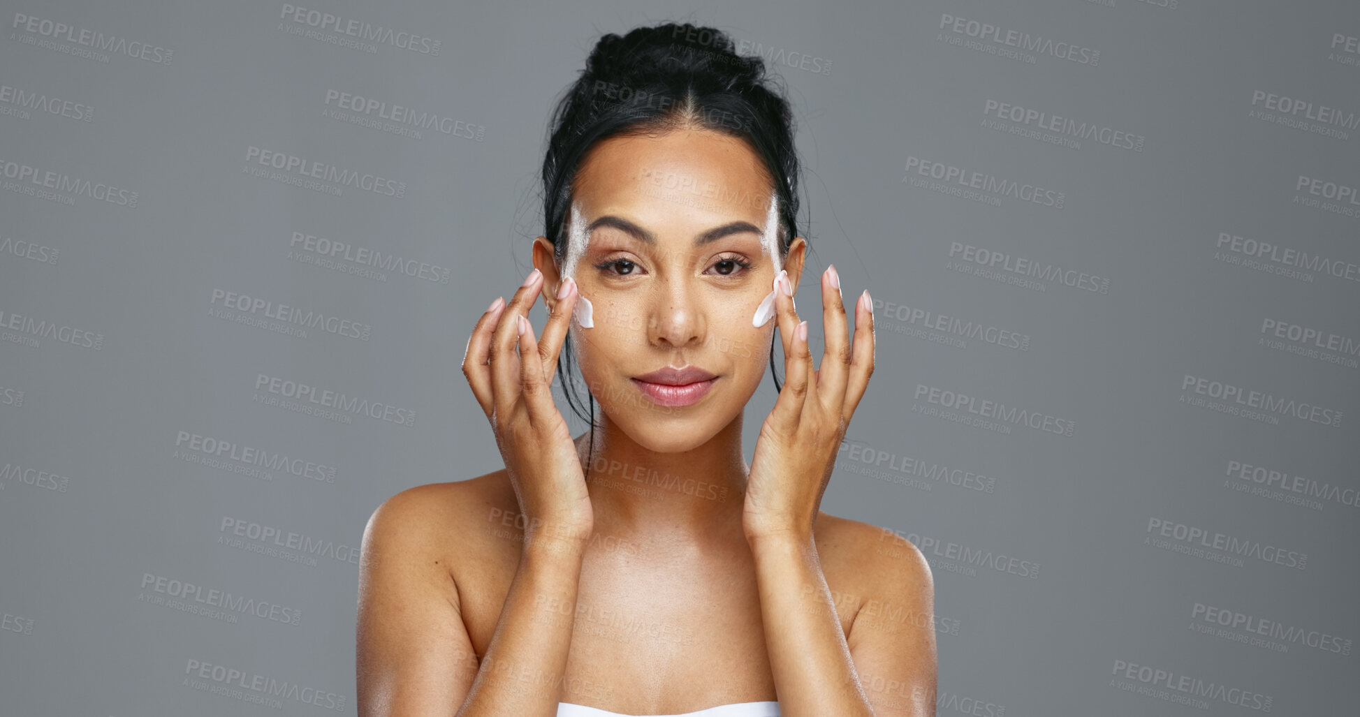 Buy stock photo Face, skincare and happy woman apply cream in studio isolated on gray background mockup. Portrait, natural beauty and model with moisturizer, cosmetics and product for wellness, dermatology or health