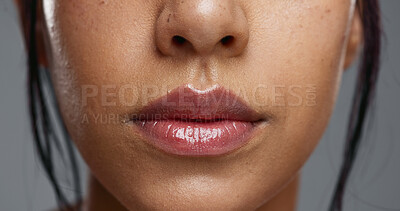 Woman, mouth and closeup in studio for dental wellness, beauty and change with cosmetics by background. Girl, teeth whitening and smile for cleaning, health and zoom for oral care with hygiene
