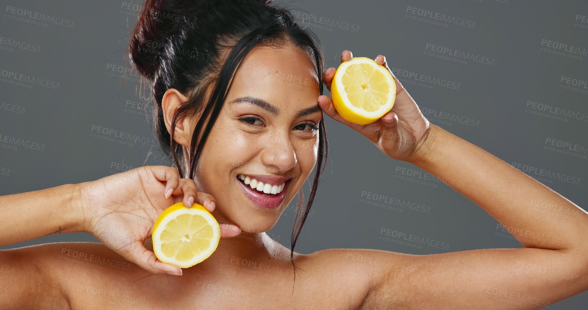 Buy stock photo Face, skincare and woman with lemons for beauty in studio isolated on gray background. Portrait, natural fruits and food of happy model for cosmetics, healthy diet and nutrition for organic vitamin c