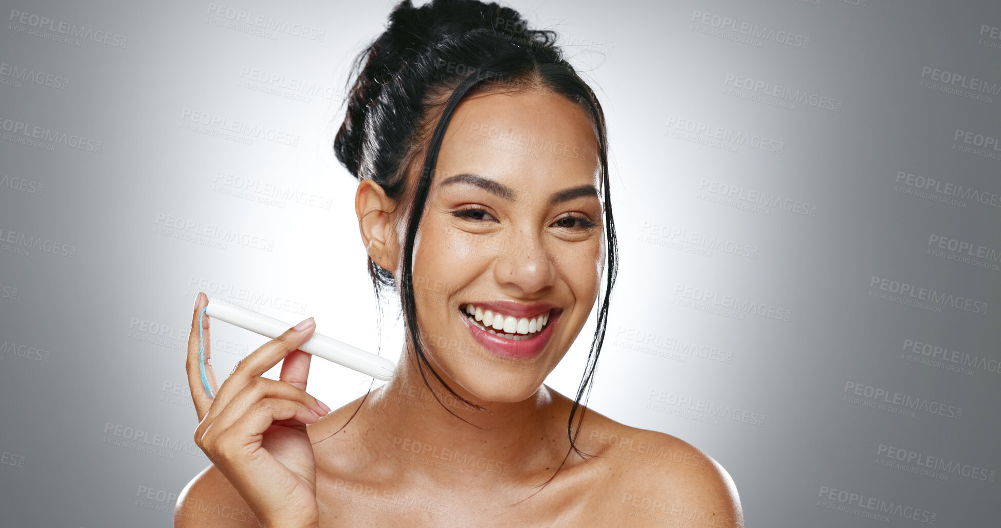 Buy stock photo Tampon, face and happy woman with feminine hygiene product, menstruation and wellness on grey background. Female health, reproductive and protection, period with sanitary tools in portrait in studio