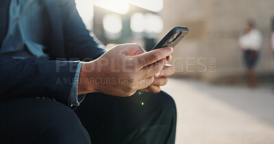 Hands, phone and closeup of businessman in the city networking on social media, mobile app or internet. Technology, typing and professional male person on website with cellphone in urban town.