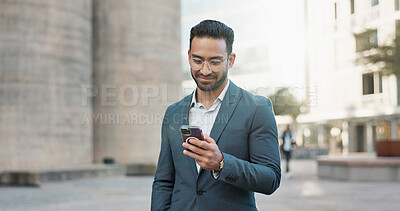 Asian businessman, mobile message and walking in city, view and confident professional in career by office buildings. Young lawyer, chat and smartphone for connection and technology in cbd in town