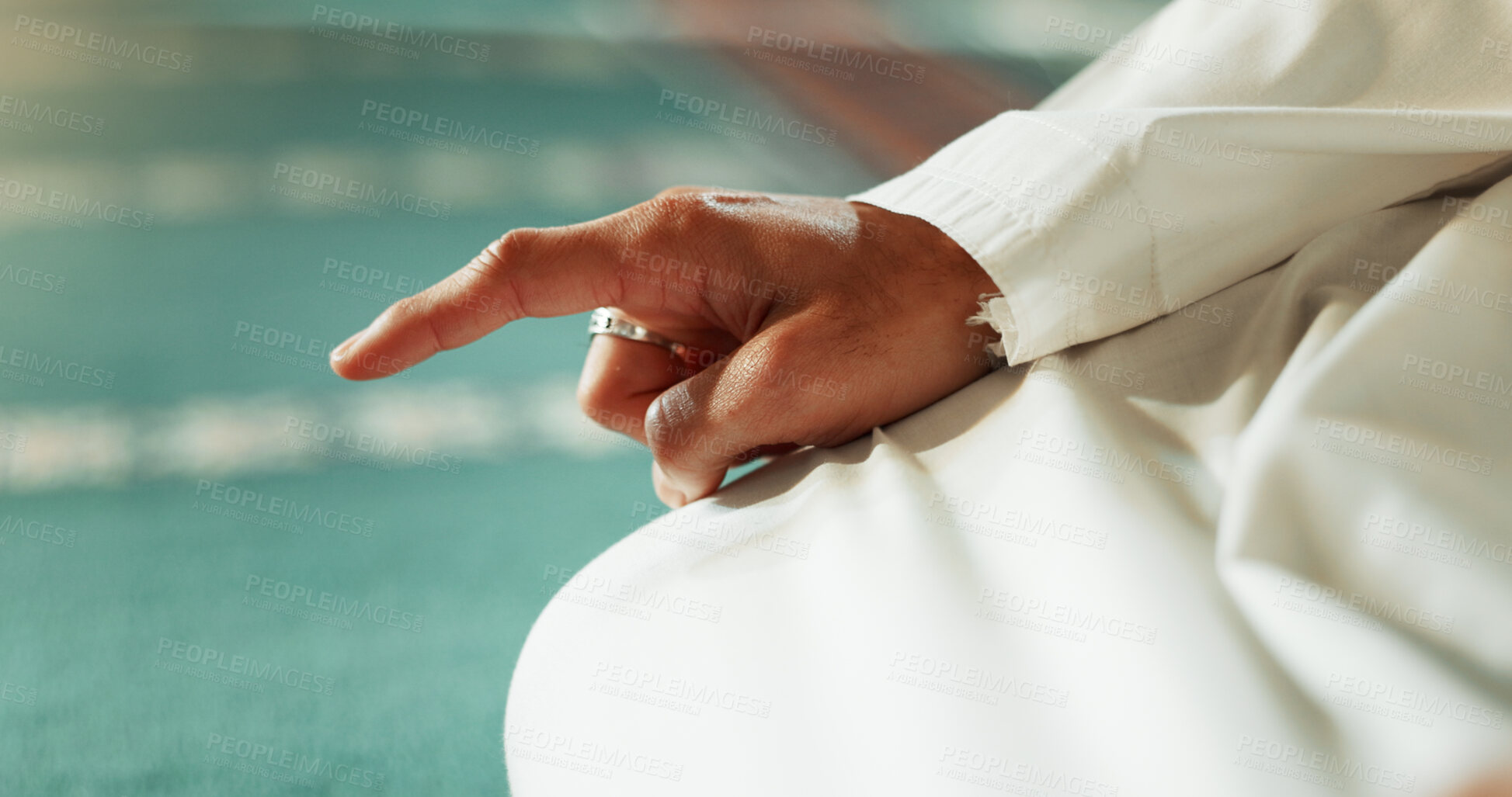 Buy stock photo Islam, floor and closeup of a pointing finger or person at a mosque for praying, hajj or support. Muslim, hope and hand of a man for a prayer, gesture or worship for respect, religion or trust