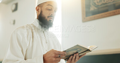 Quran, Muslim and man reading for faith in a mosque for praying, peace and spiritual care in holy religion for Allah. Respect, Ramadan and Islamic person with kindness, hope and humble after worship