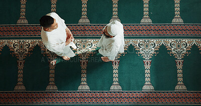 Muslim, religion and top view of people in mosque for talking, conversation and greeting in community. Islamic worship, friends and above of men in religious building for Ramadan, prayer and praise