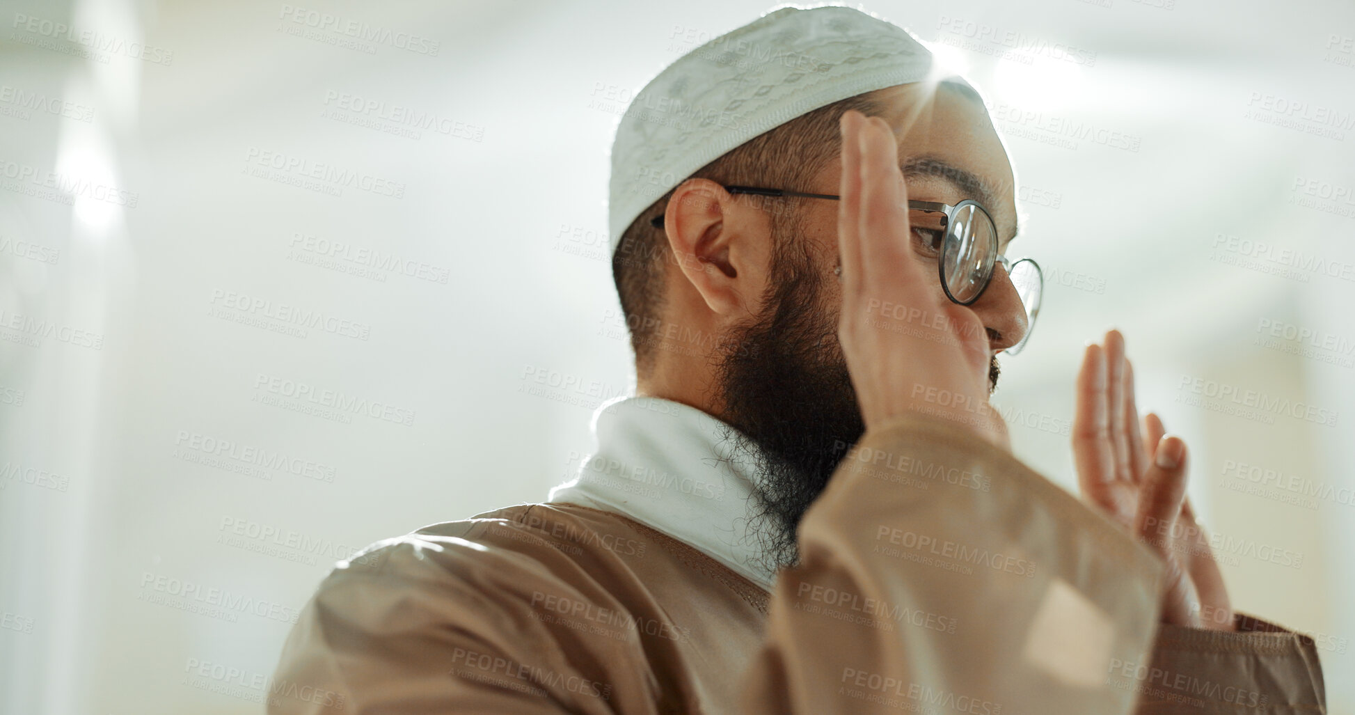 Buy stock photo Islamic prayer, faith and man in mosque with gratitude, mindfulness and love for God or Allah. Worship, religion and Muslim imam praying for hope in holy temple praise, spiritual teaching and peace.