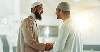 Muslim, handshake and people in mosque for greeting, conversation and respect in Islamic community. Worship, friends and men shaking hands in religious building for Ramadan Kareem, prayer and support