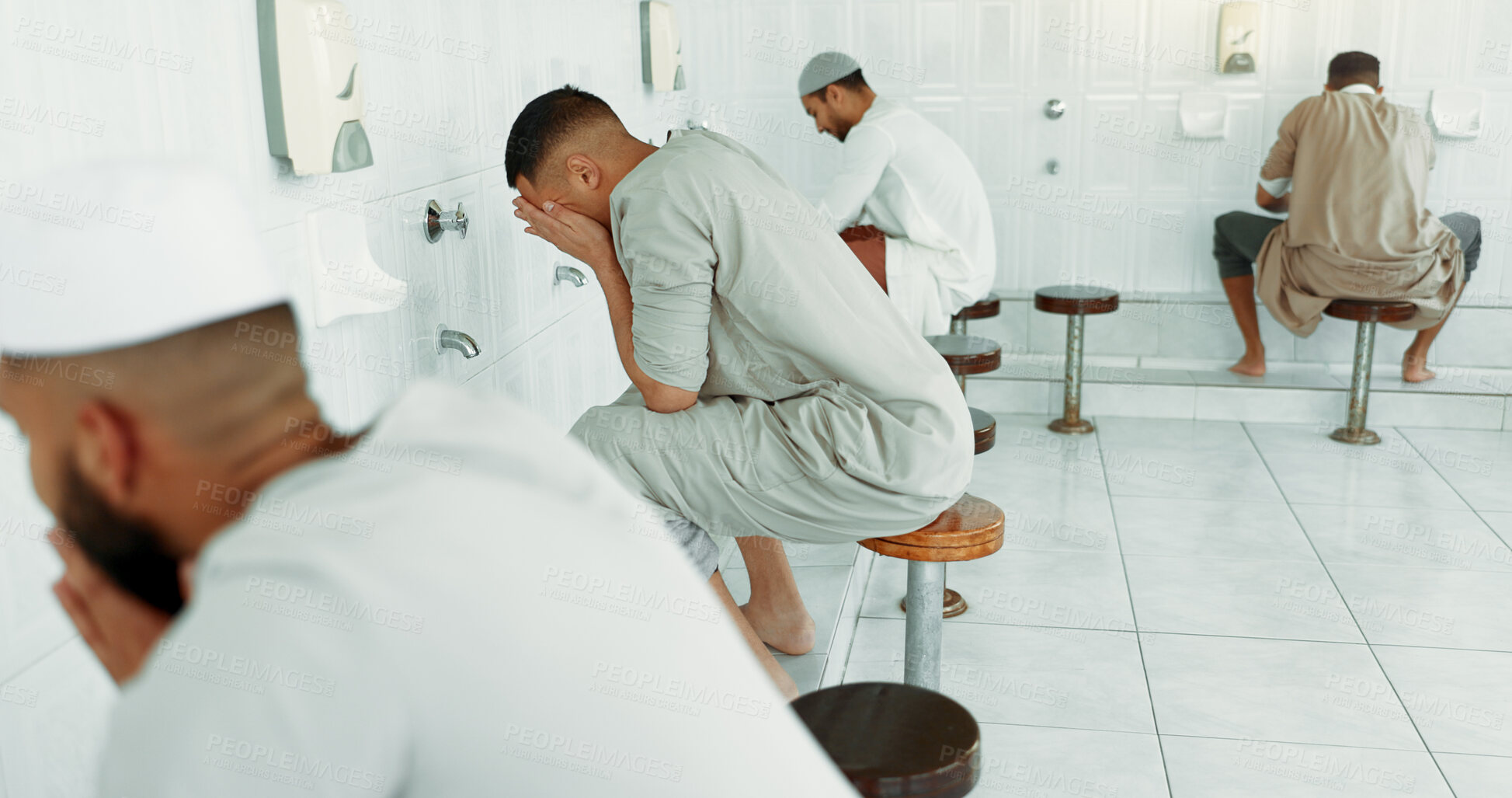 Buy stock photo Muslim, wash routine and men before eid prayer in bathroom for purity, and cleaning ritual. Islamic, worship and faith of group of people with wudu together at a mosque or temple for holy practice