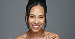 Face, skincare and happy woman in studio for beauty isolated on a gray background. Portrait, natural and model touch skin in spa facial treatment for aesthetic, glow and cosmetic wellness for health