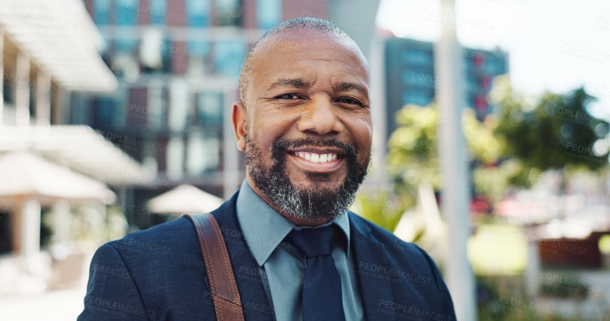 Buy stock photo Smile, face and mature businessman in the city with positive, good and confident attitude. Happy, portrait and professional African male lawyer with legal career standing in urban town street.