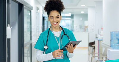 Medical, tablet or surgeon typing for research on social media to for medicine news online in hospital. Woman doctor reading, scroll or healthcare nurse browsing on technology for telehealth services