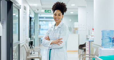Medical, face and woman or doctor with crossed arms for wellness, trust and service in hospital or clinic. Portrait, person and expert with happiness for career, cardiology or nursing at workplace