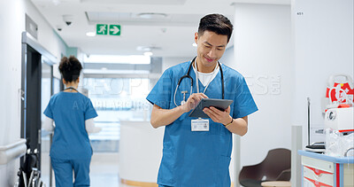 Walking, tablet or doctor in hospital with research on social media to search for medicine info online. Asian man reading, smile or medical healthcare nurse browsing on technology for telehealth news