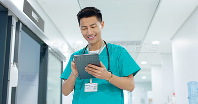 Doctor, nurse and smile on tablet for hospital services, thinking of healthcare and typing information online. Medical worker or Asian man in China with digital technology, clinic inspection or ideas