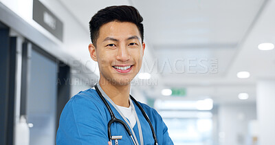 Healthcare, face and asian man or doctor with smile for wellness, trust and service in hospital or clinic. Portrait, person and expert with happiness for career, cardiology or nursing at workplace