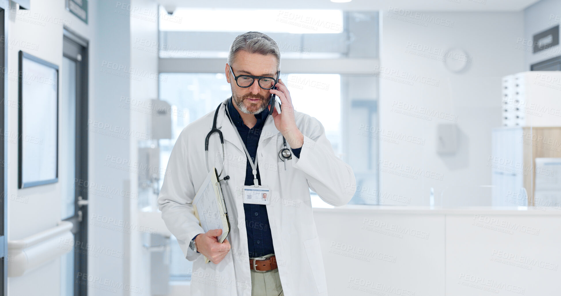 Buy stock photo Phone call, doctor and man walking in hospital, talking or conversation for healthcare. Smartphone, smile and medical professional with documents for communication, consulting or telehealth in clinic