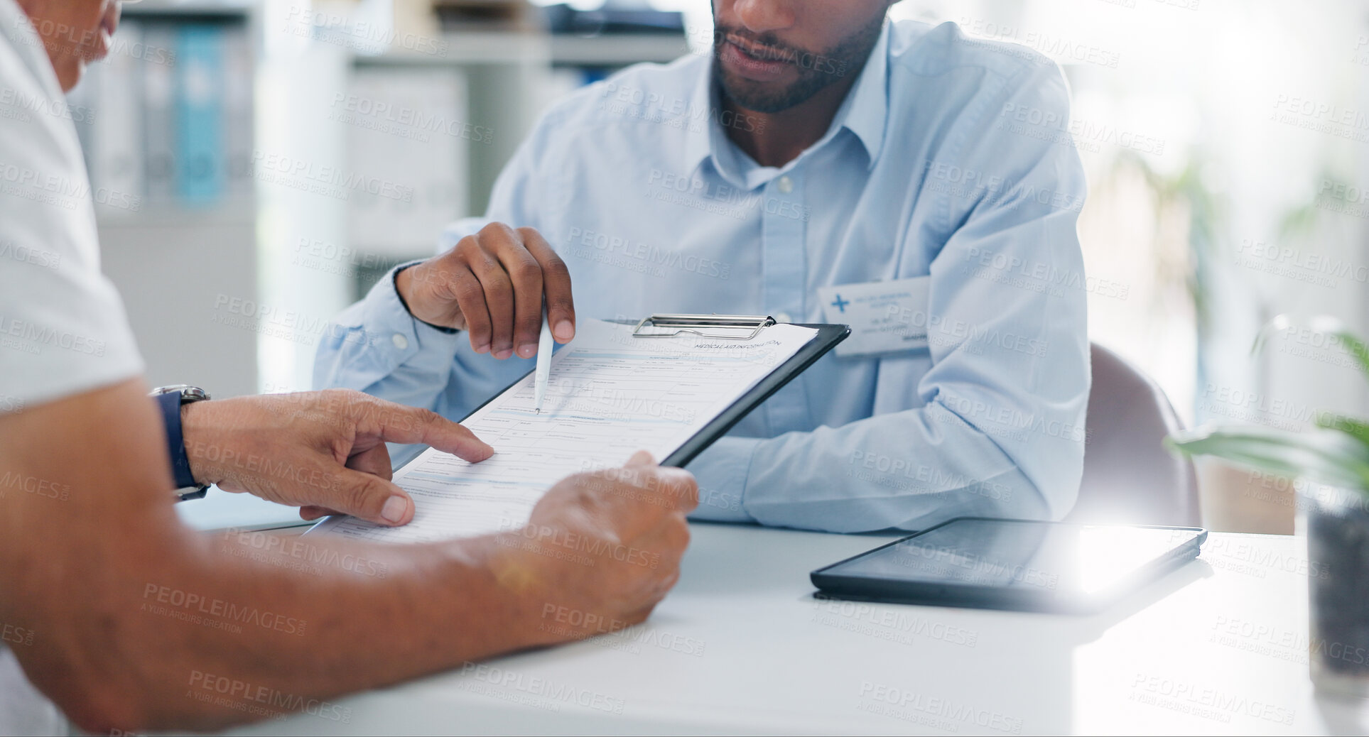Buy stock photo Man, doctor and hands with form in consultation for signature, application or health insurance at hospital. Closeup of person or medical employee explaining document or paperwork to patient at clinic