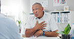 Senior, man and consulting doctor on chest pain, sore or discomfort in healthcare hospital. Mature, male person or patient talking to medical employee for heart ache, breathing or illness at clinic
