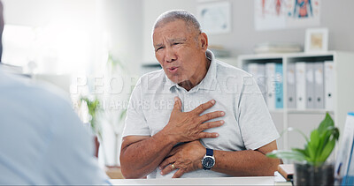 Buy stock photo Senior, man and consulting doctor on chest pain, sore or discomfort in healthcare hospital. Mature, male person or patient talking to medical employee for heart ache, breathing or illness at clinic