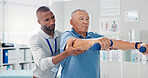 Dumbbells, physical therapy and old man with physiotherapist, muscle training and strength with senior care. Health, wellness and men at physio clinic for weightlifting, rehabilitation and equipment