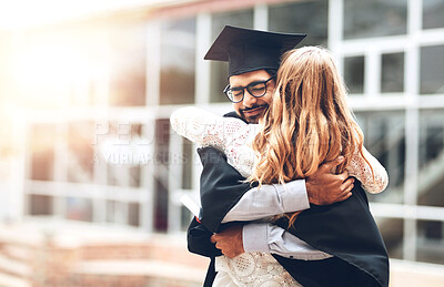 Buy stock photo Rearview shot of a woman hugging a student on graduation day