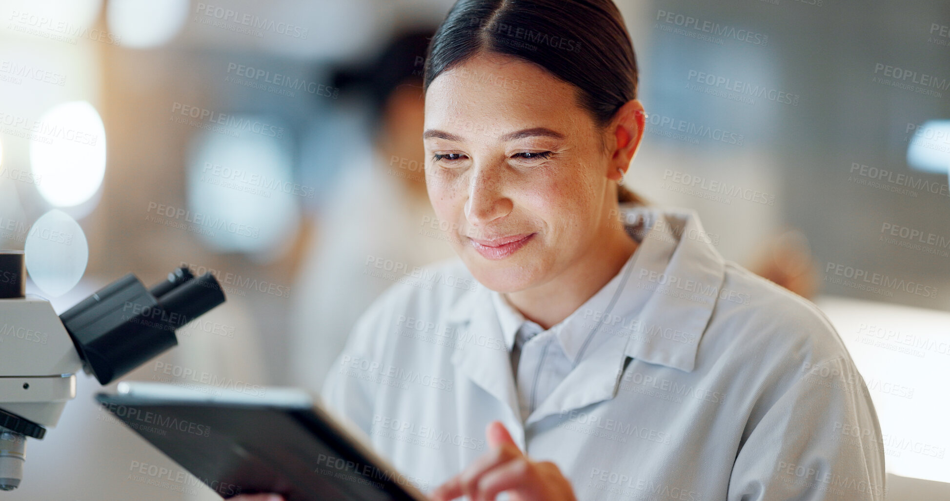 Buy stock photo Scientist, woman and tablet, microscope or laboratory research for DNA analysis and happy with medical study. Student or science expert in biotechnology with digital software and lens check for data