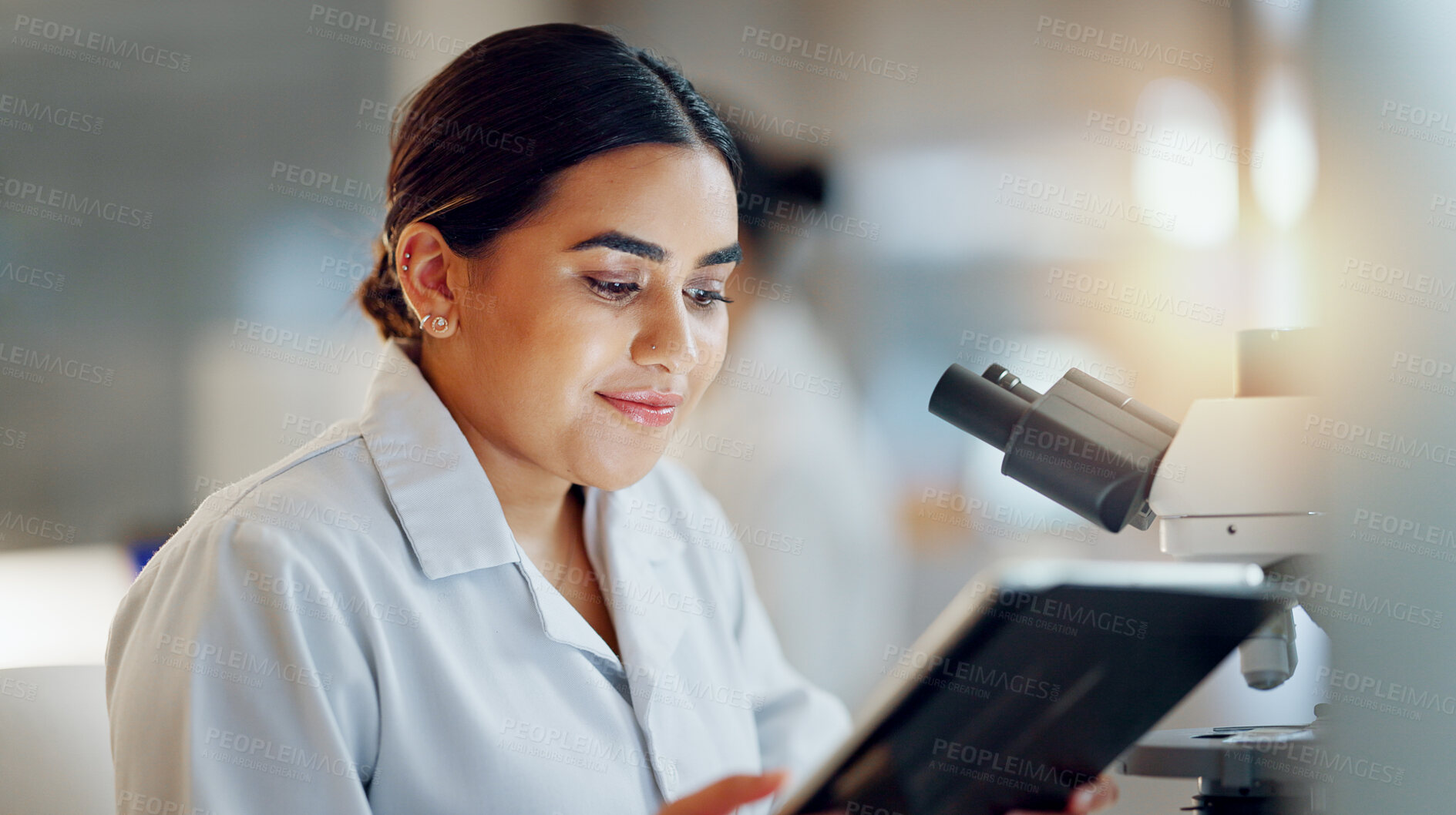 Buy stock photo Scientist, woman and tablet, microscope or laboratory research for DNA analysis and happy with medical study. Student or science expert in biotechnology with digital software and lens check for data