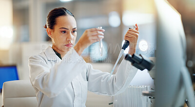 Science, results and woman with pipette, test tube and microscope for biotech solution in laboratory. Medical research, scientist or lab technician in study for healthcare, medicine or vaccine test.