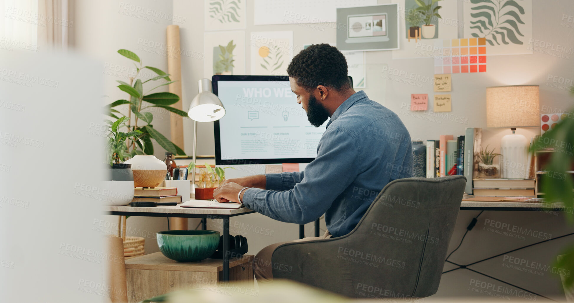 Buy stock photo Night, desk and a black man with a notebook for planning of work goals, target or ideas for a project. Workspace, strategy and an African businessman writing for deadline inspiration or notes