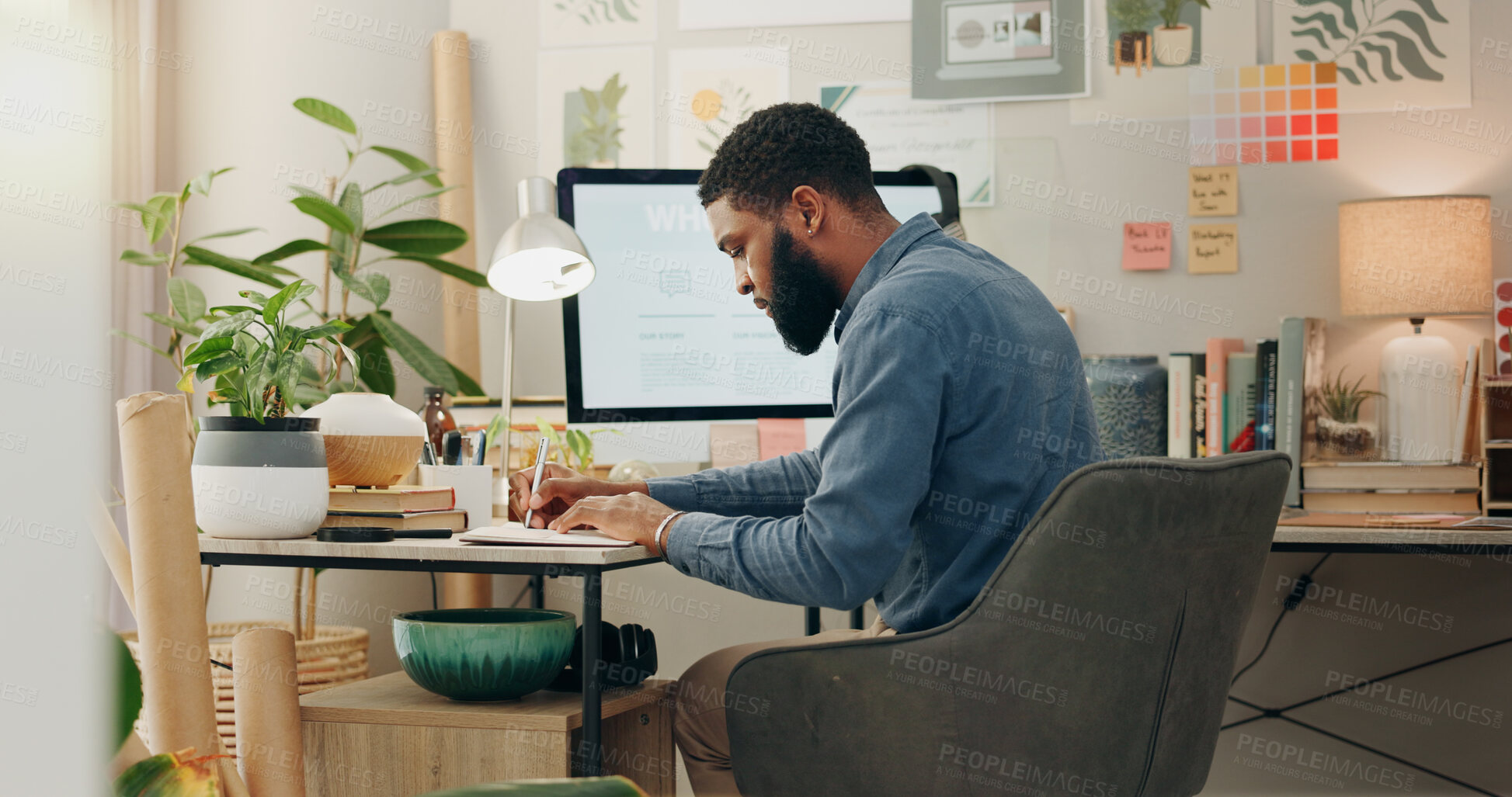 Buy stock photo Night, desk and a black man with a notebook for planning of work goals, target or ideas for a project. Workspace, strategy and an African businessman writing for deadline inspiration or notes