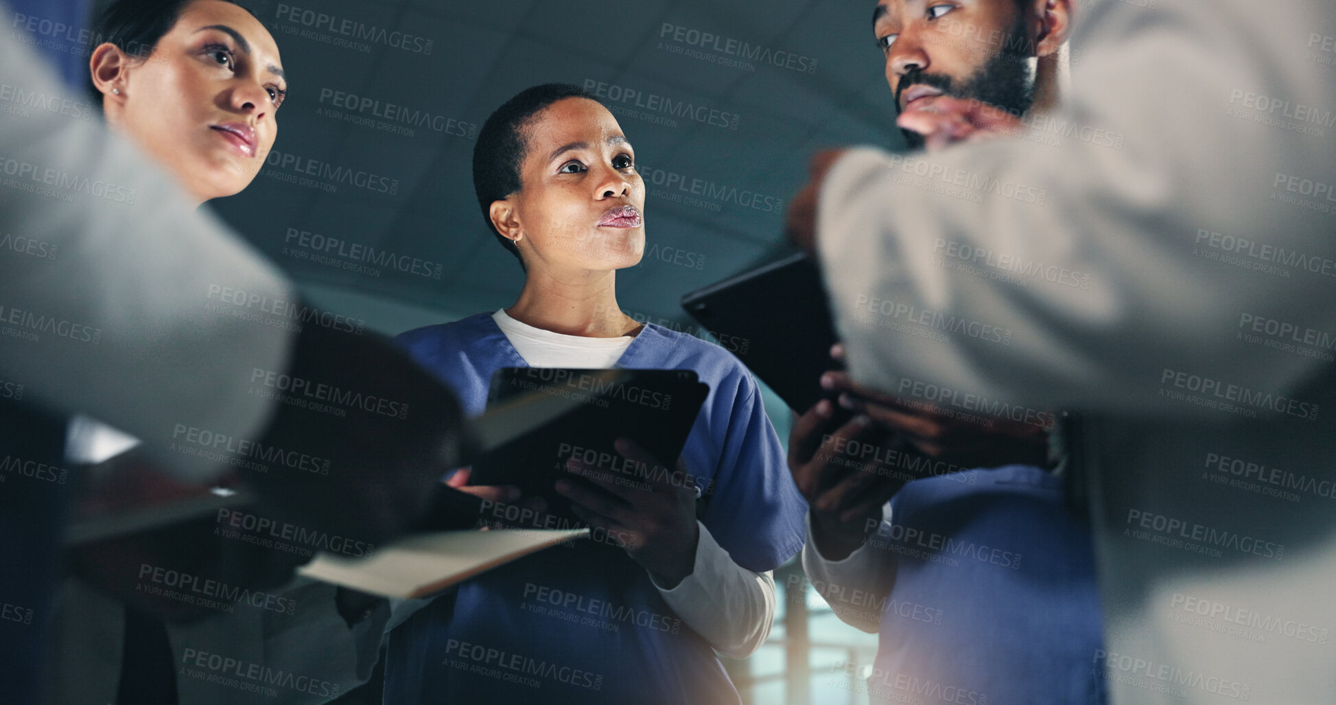 Buy stock photo Doctor, team and meeting at night in planning, surgery or project deadline together at the hospital. Group of medical or healthcare professionals working late in teamwork discussion or plan at clinic