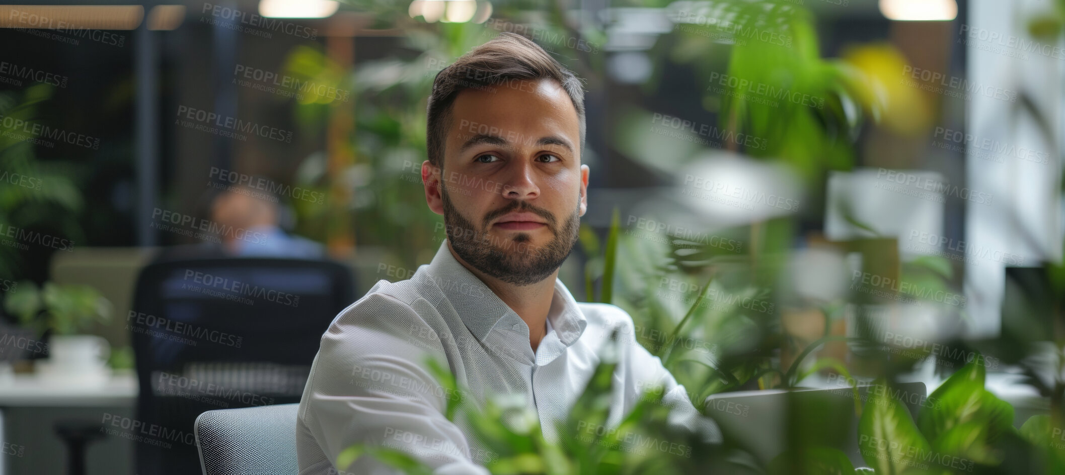 Buy stock photo Man, laptop and business portrait in an office for environment, sustainability and nature. Confident, male executive sitting alone for marketing, eco strategy and leadership in green workplace