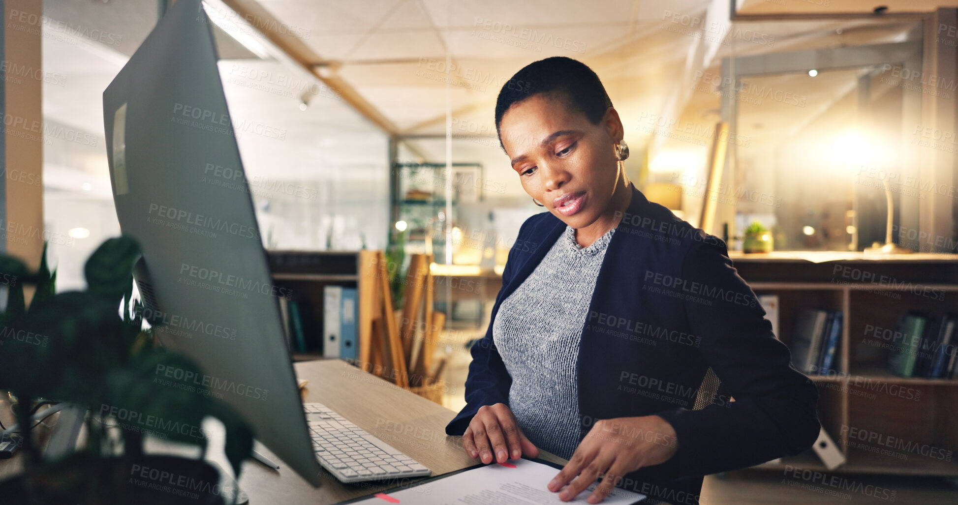 Buy stock photo Business woman, computer and typing with document at a desk for data entry in an office. African entrepreneur person working at a desktop with paperwork for information, research or online report