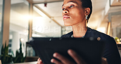 Business, black woman and tablet at night in office to search internet, scroll information and planning website. Face of serious employee working late on digital tech, online data or social media app