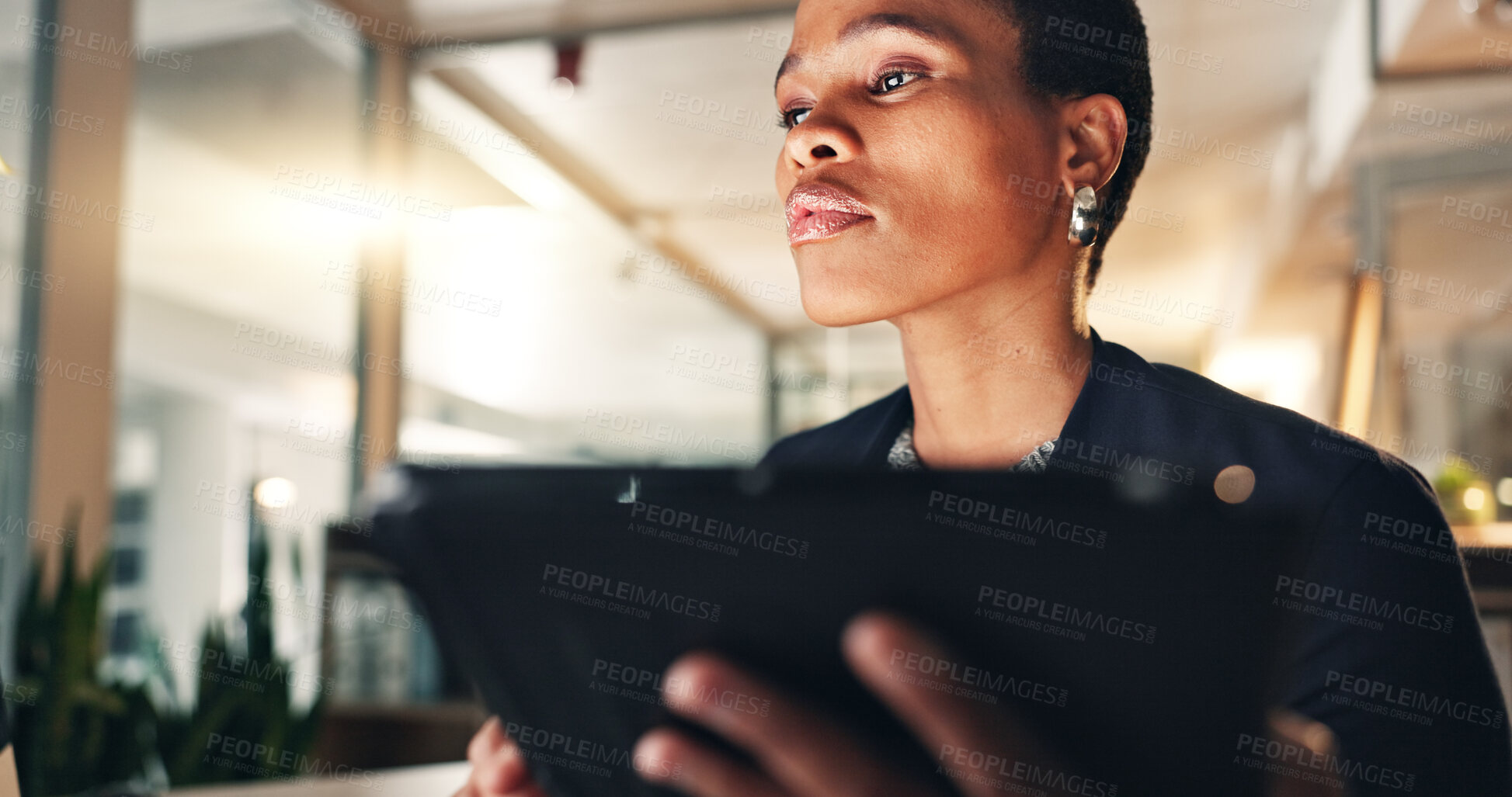 Buy stock photo Business, black woman and tablet at night in office to search internet, scroll information and planning website. Face of serious employee working late on digital tech, online data or social media app