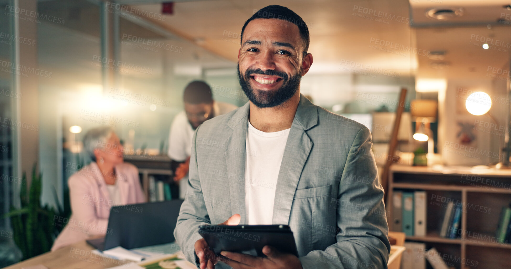 Buy stock photo Tablet, meeting and business man at night in office, working on research project, schedule and planning. Happy, corporate and portrait of worker on digital tech for internet, website and feedback