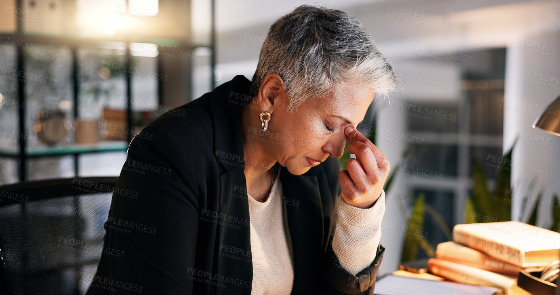 Buy stock photo Night, business and senior woman with headache, stress and burnout with deadline and overworked. Mature person, evening or PR consultant with a migraine or frustrated with audit, crisis or depression