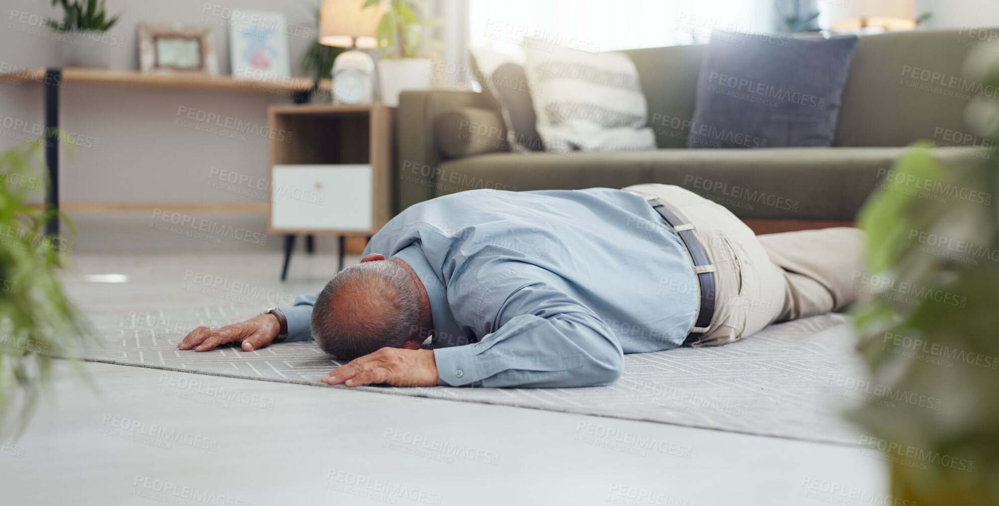 Buy stock photo Man, faint and accident on home floor with heart attack, cardiac arrest or unconscious in living room. Mature person on ground and alone with medical risk, emergency and healthcare problem or death