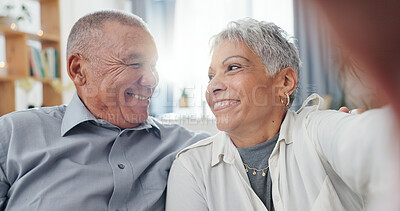 Senior couple, selfie and living room at home with smile, love and care together on a sofa. Social media, happy and face in a lounge with support and laughing in retirement with marriage on a couch
