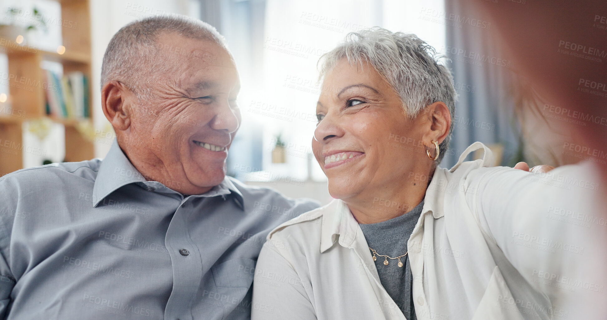 Buy stock photo Senior couple, selfie and living room at home with smile, love and care together on a sofa. Social media, happy and face in a lounge with support and laughing in retirement with marriage on a couch