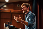 Businessman, conference or speaker sharing information at a business seminar for knowledge, motivational or coaching. Confident, man or coach speaks to audience at a convention or corporate event